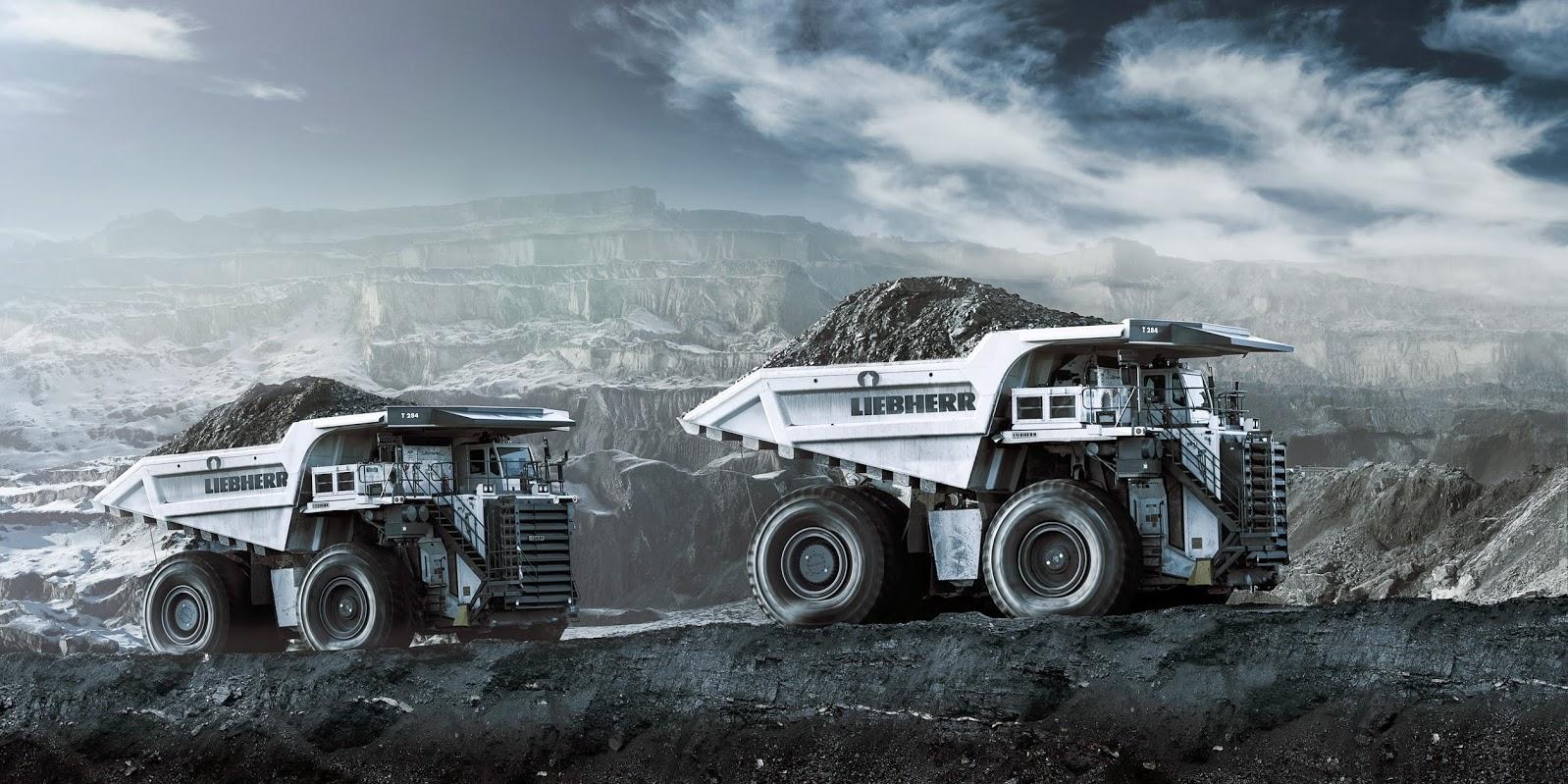 Mining haul trucks at an open pit